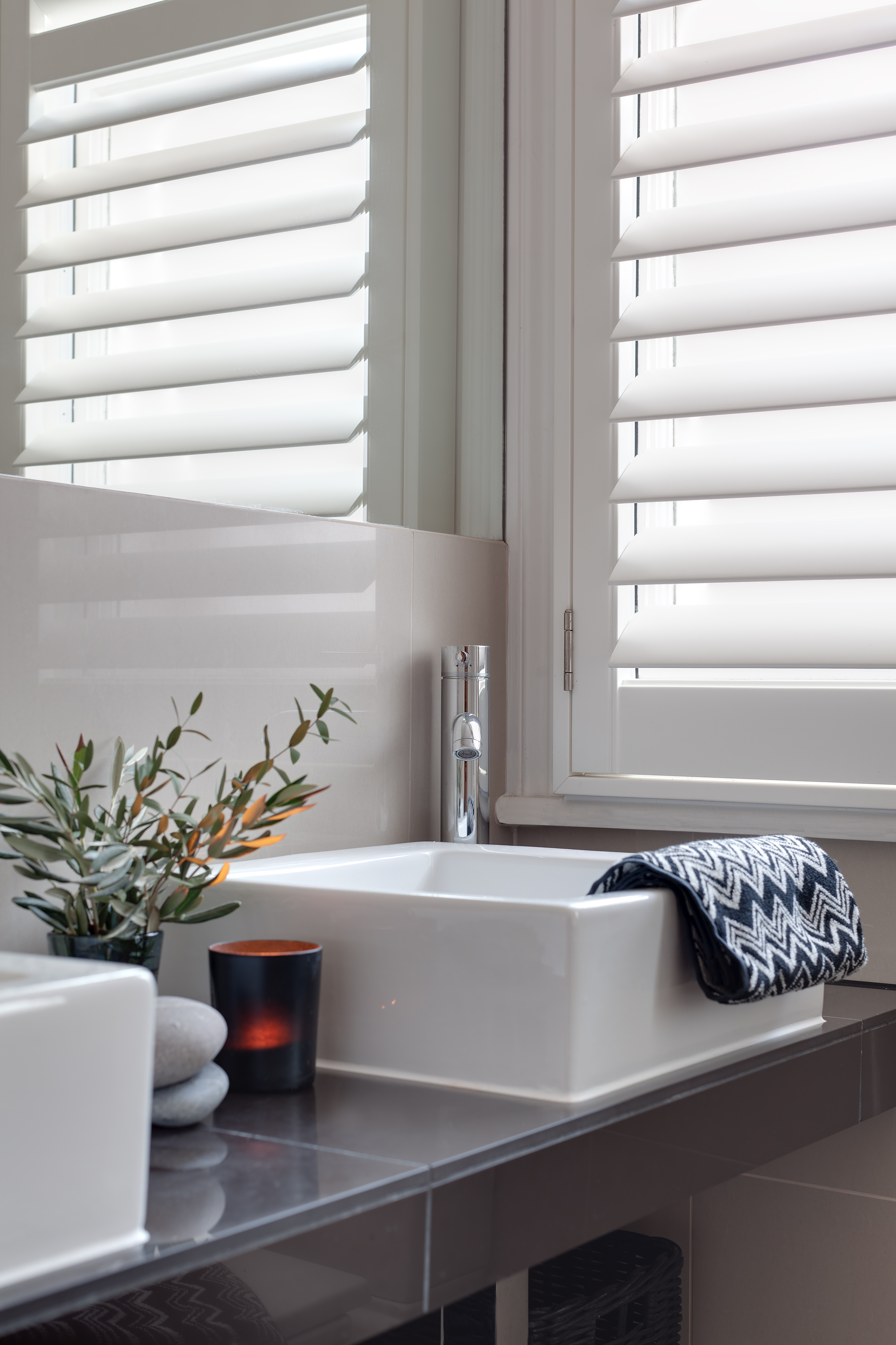 SureFix Shutters Waterlooville – Alu Core PV, Beaded style, portrait Alu Core PV plantation-style window shutters in white in a bathroom